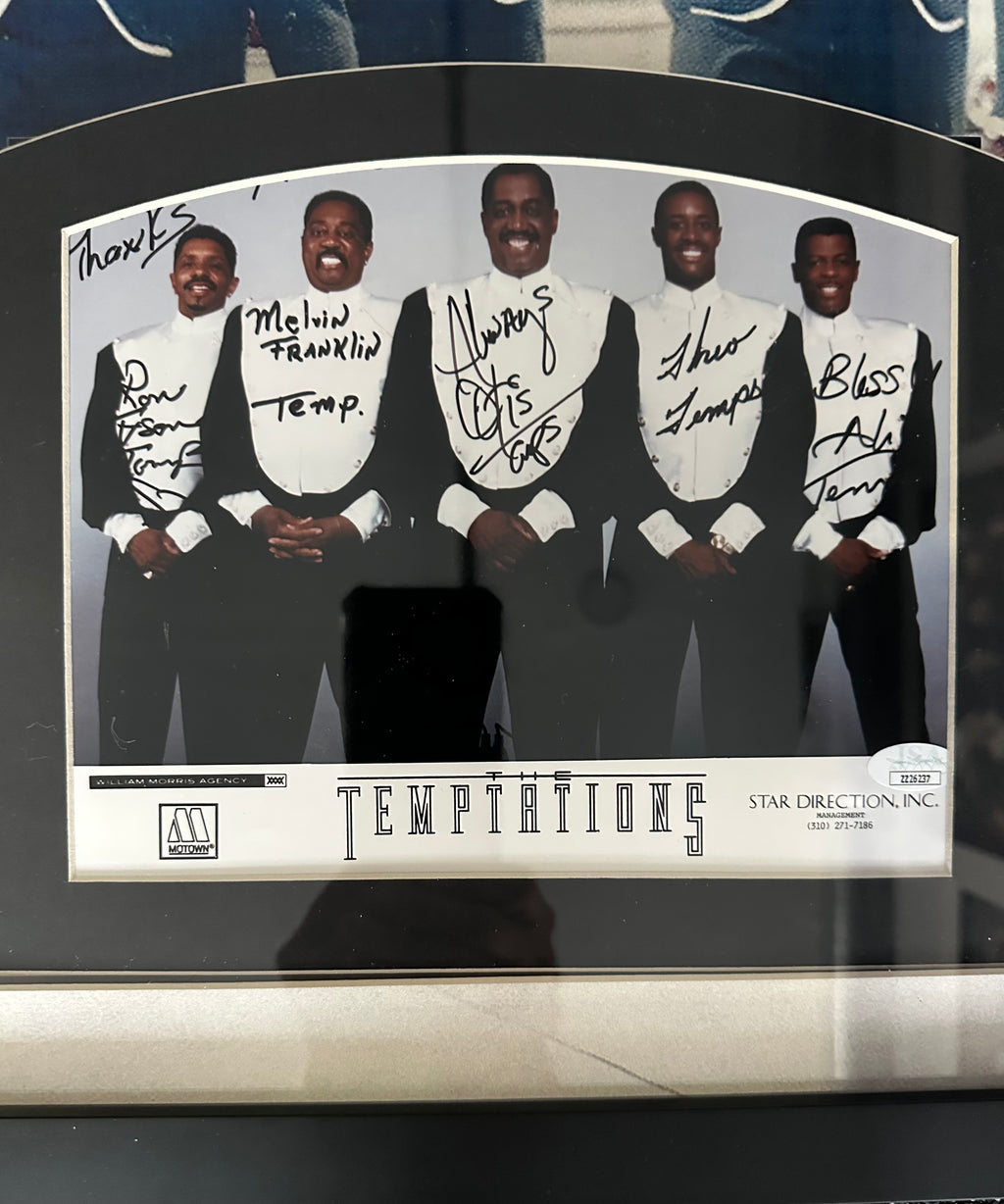 The Temptations band autographed with "My Girl" sheet music