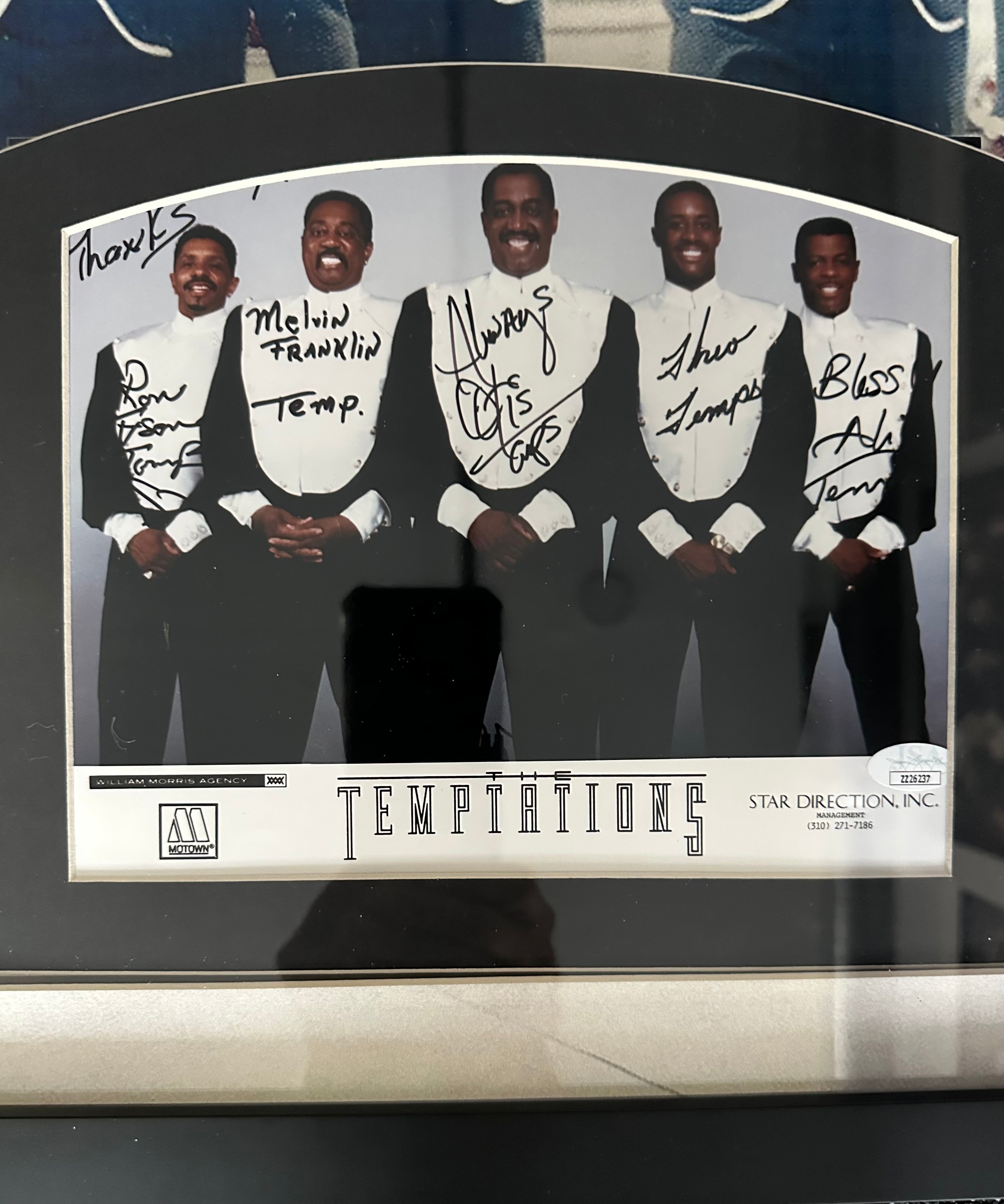 The Temptations band autographed with "My Girl" sheet music