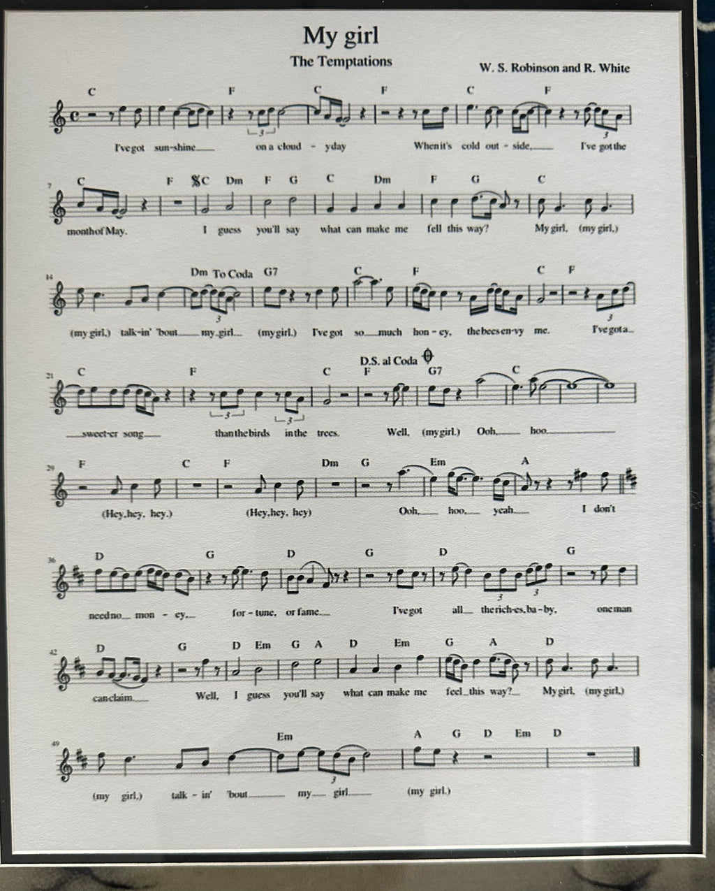 The Temptations band autographed with "My Girl" sheet music