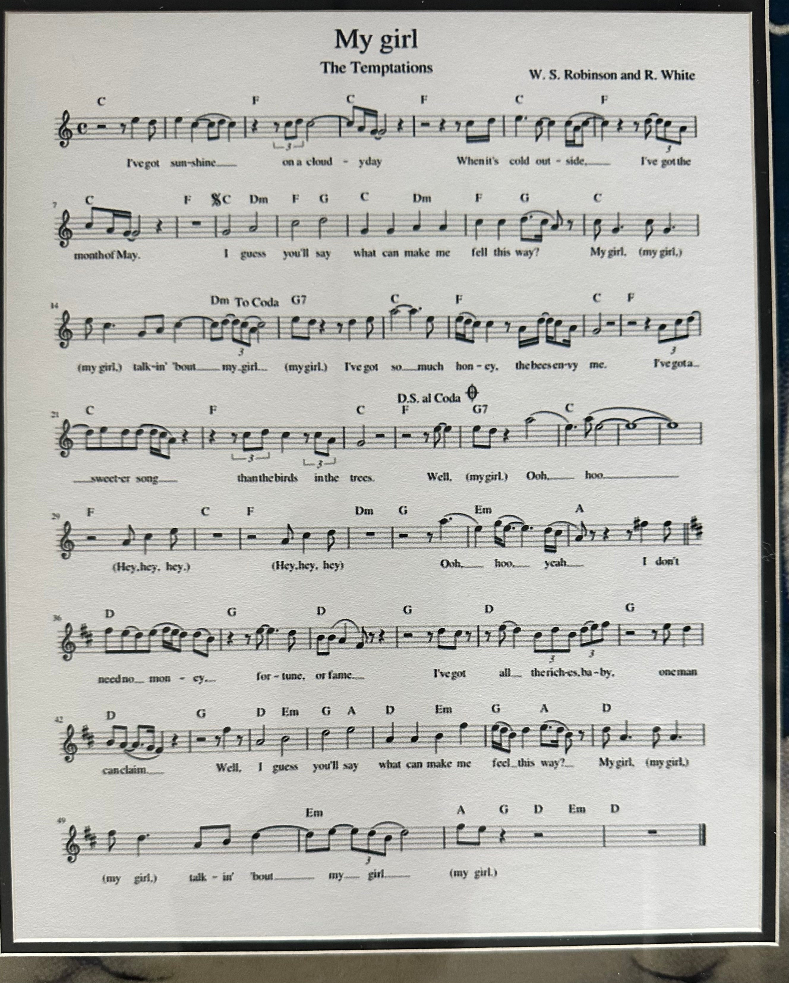 The Temptations band autographed with "My Girl" sheet music