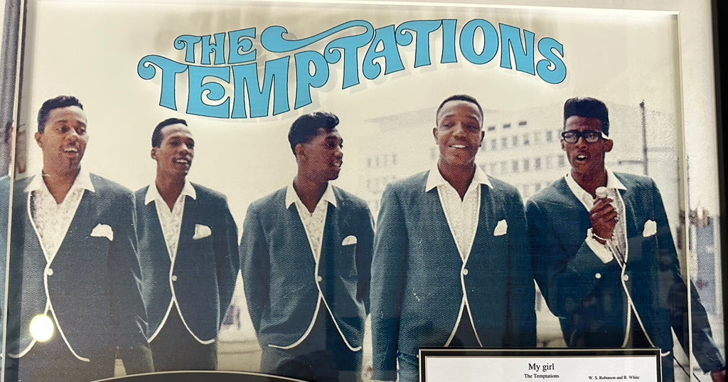 The Temptations band autographed with "My Girl" sheet music