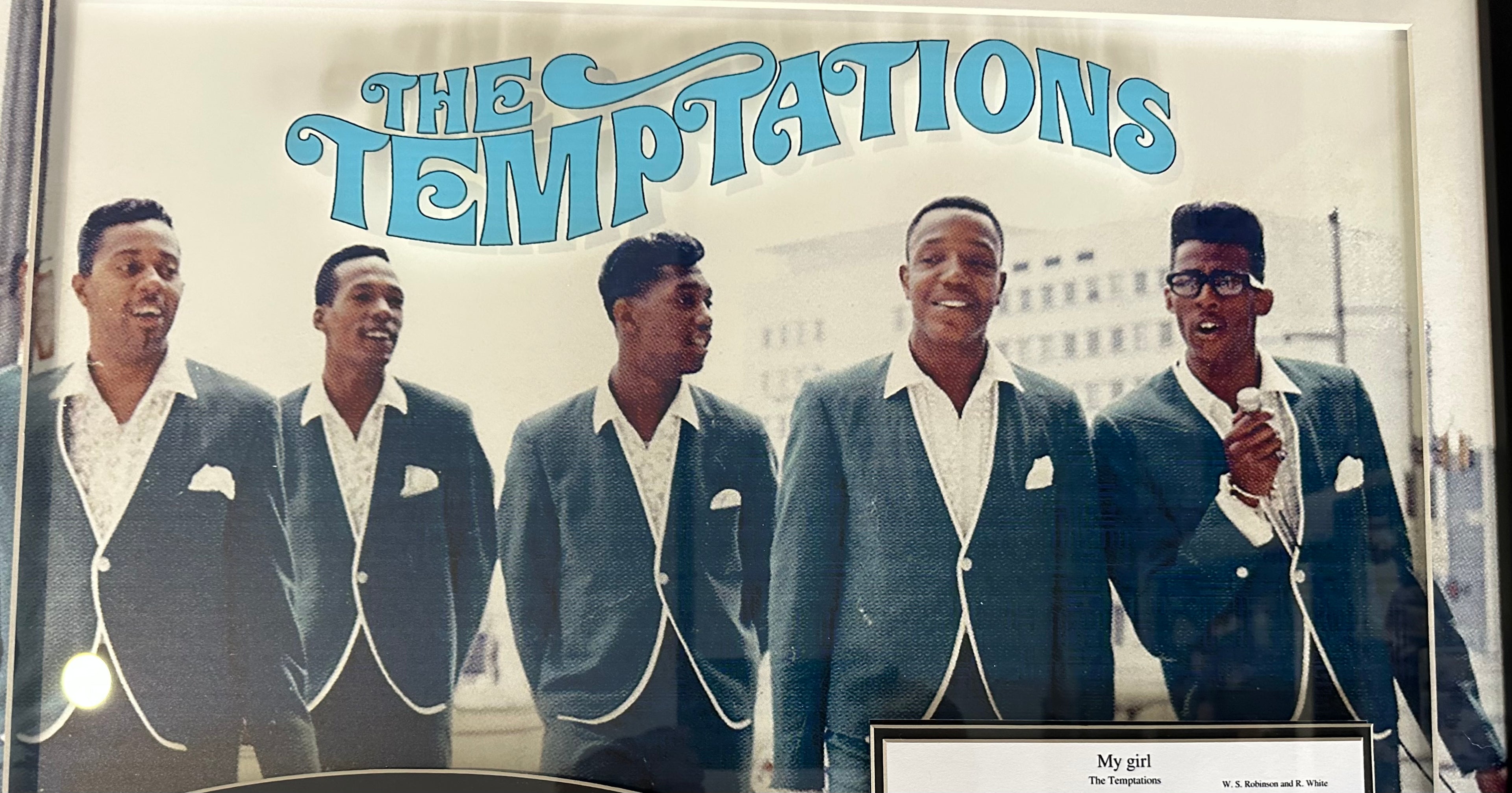 The Temptations band autographed with "My Girl" sheet music