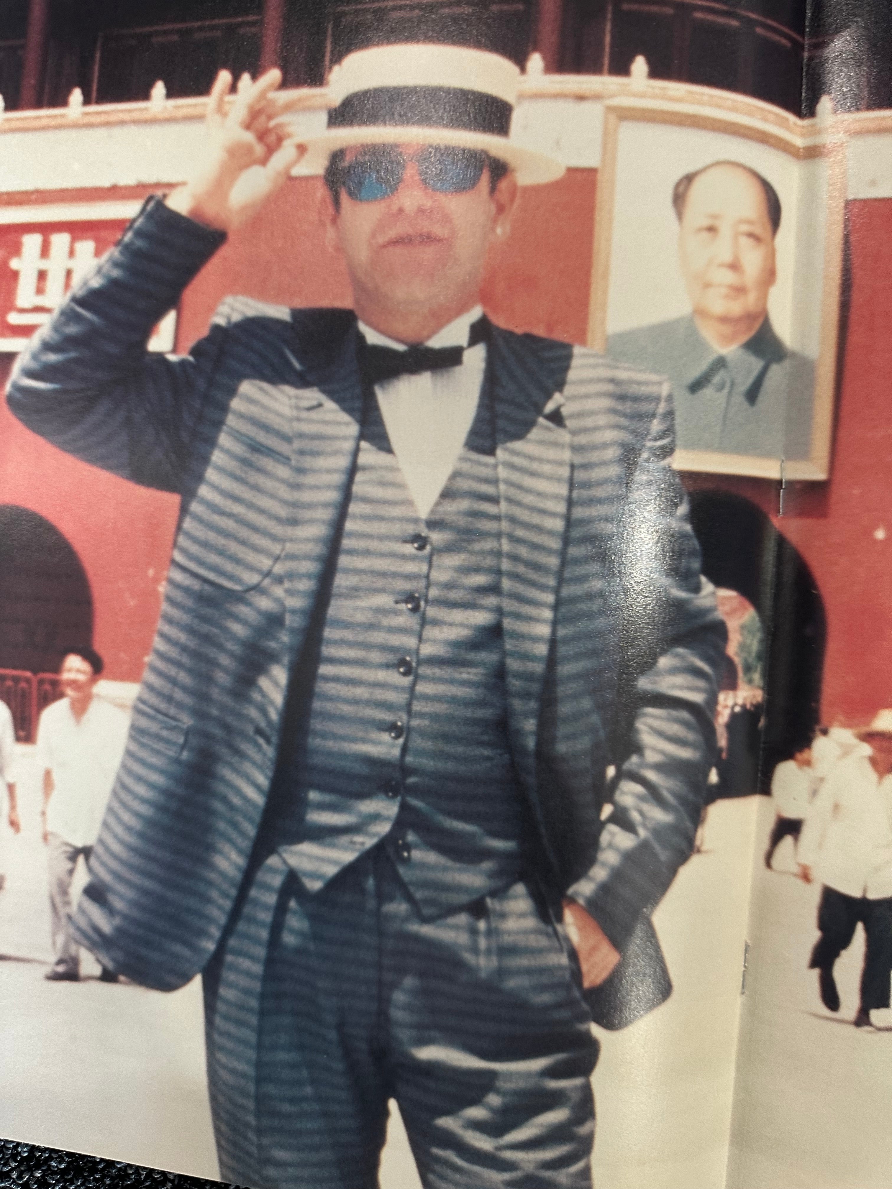 Elton John autographed program with pictures