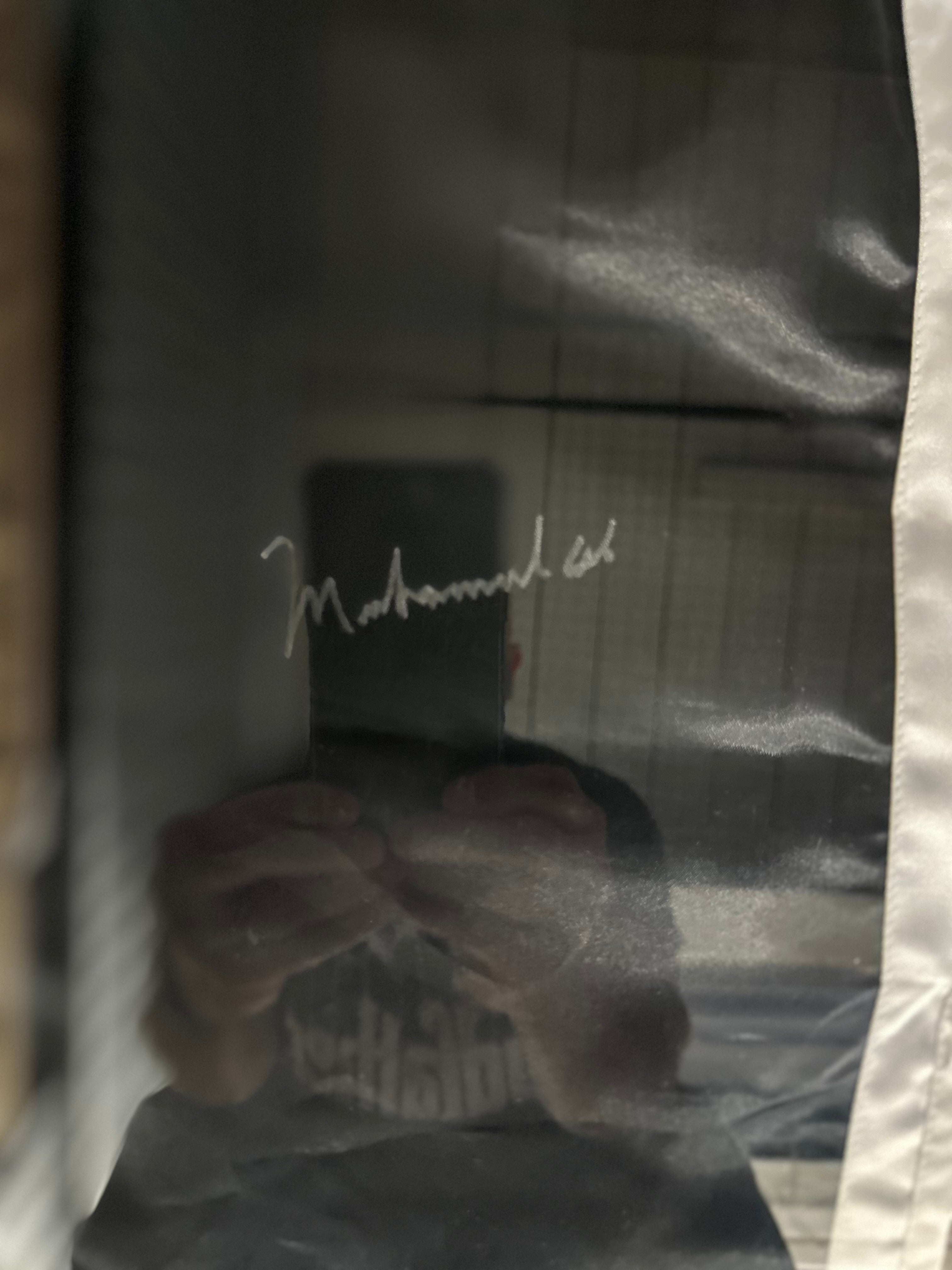 Muhammad Ali Autographed 8 x 10 photo and Boxing shorts