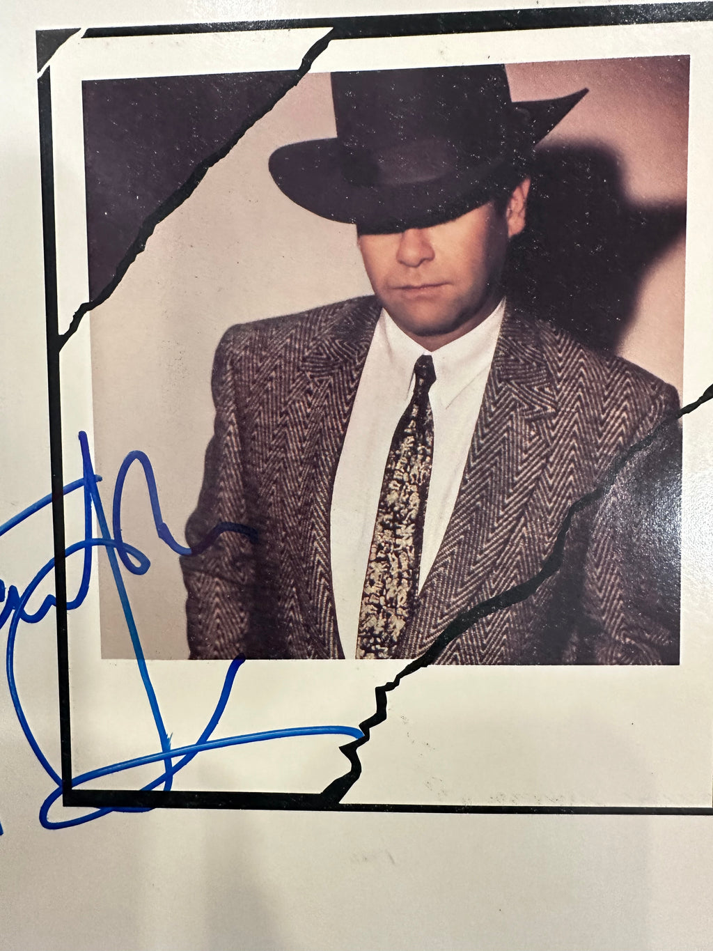 Elton John autographed program with pictures