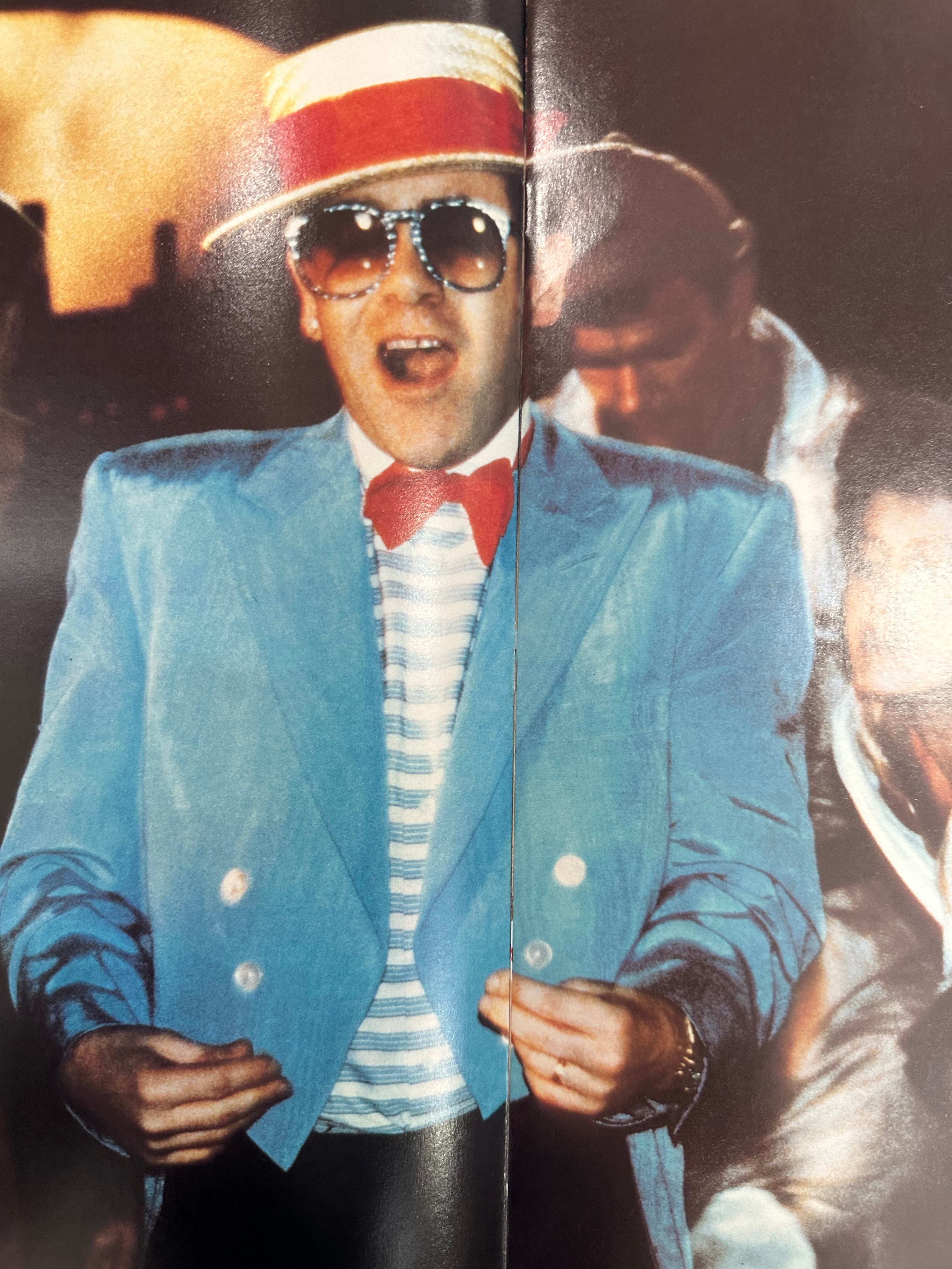 Elton John autographed program with pictures