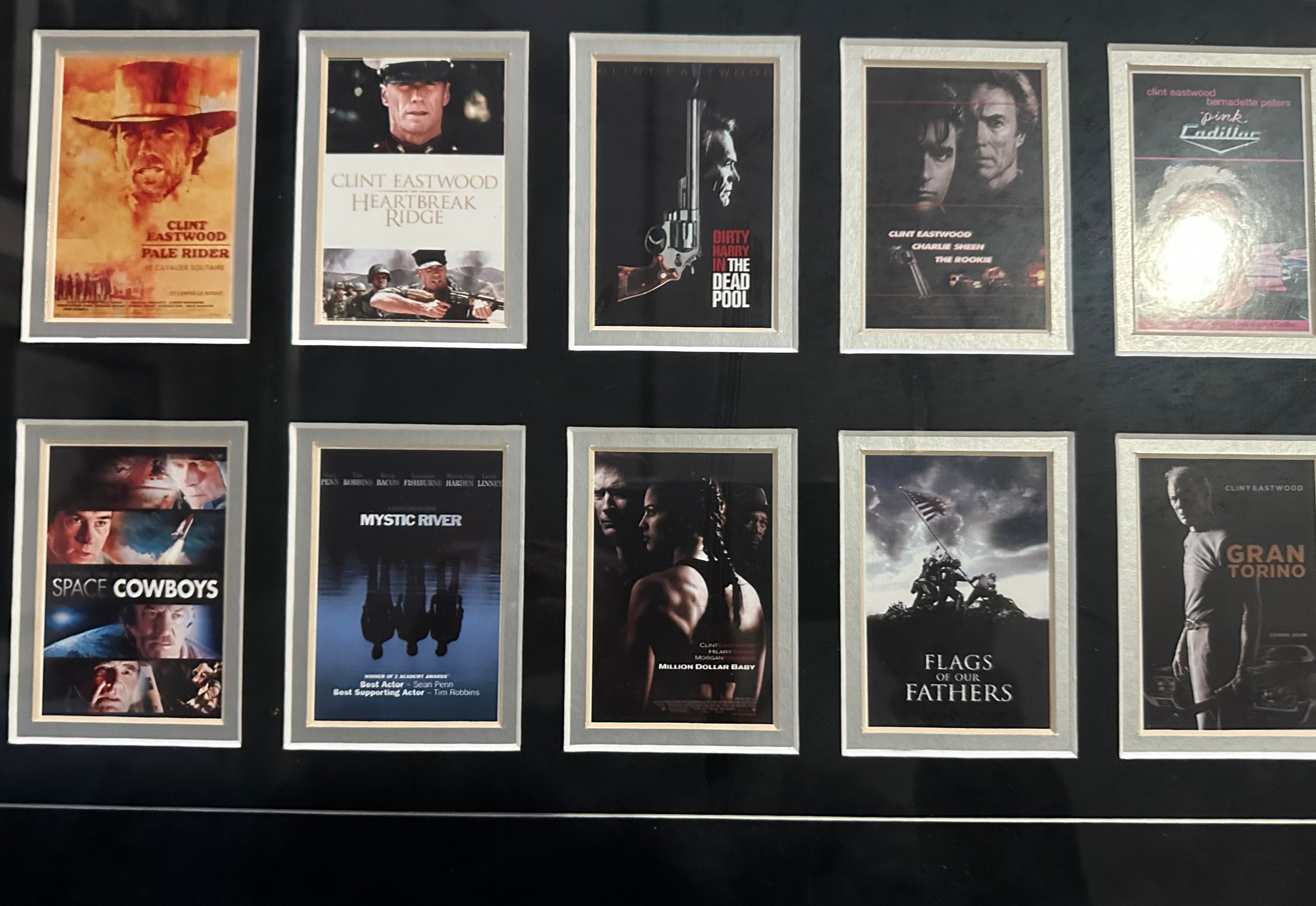 Clint Eastwood autographed 11x14 photo with 39 Eastwood movie posters