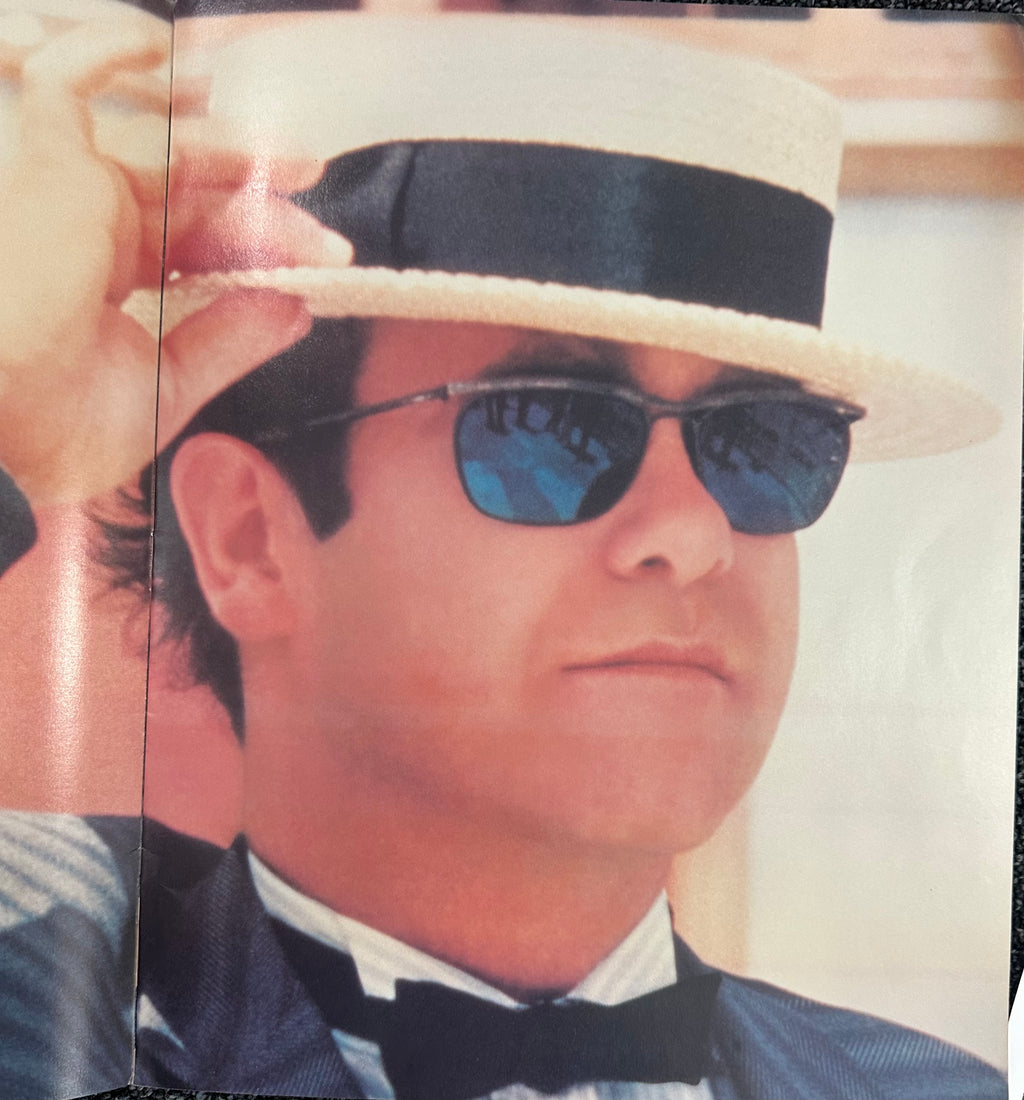 Elton John autographed program with pictures