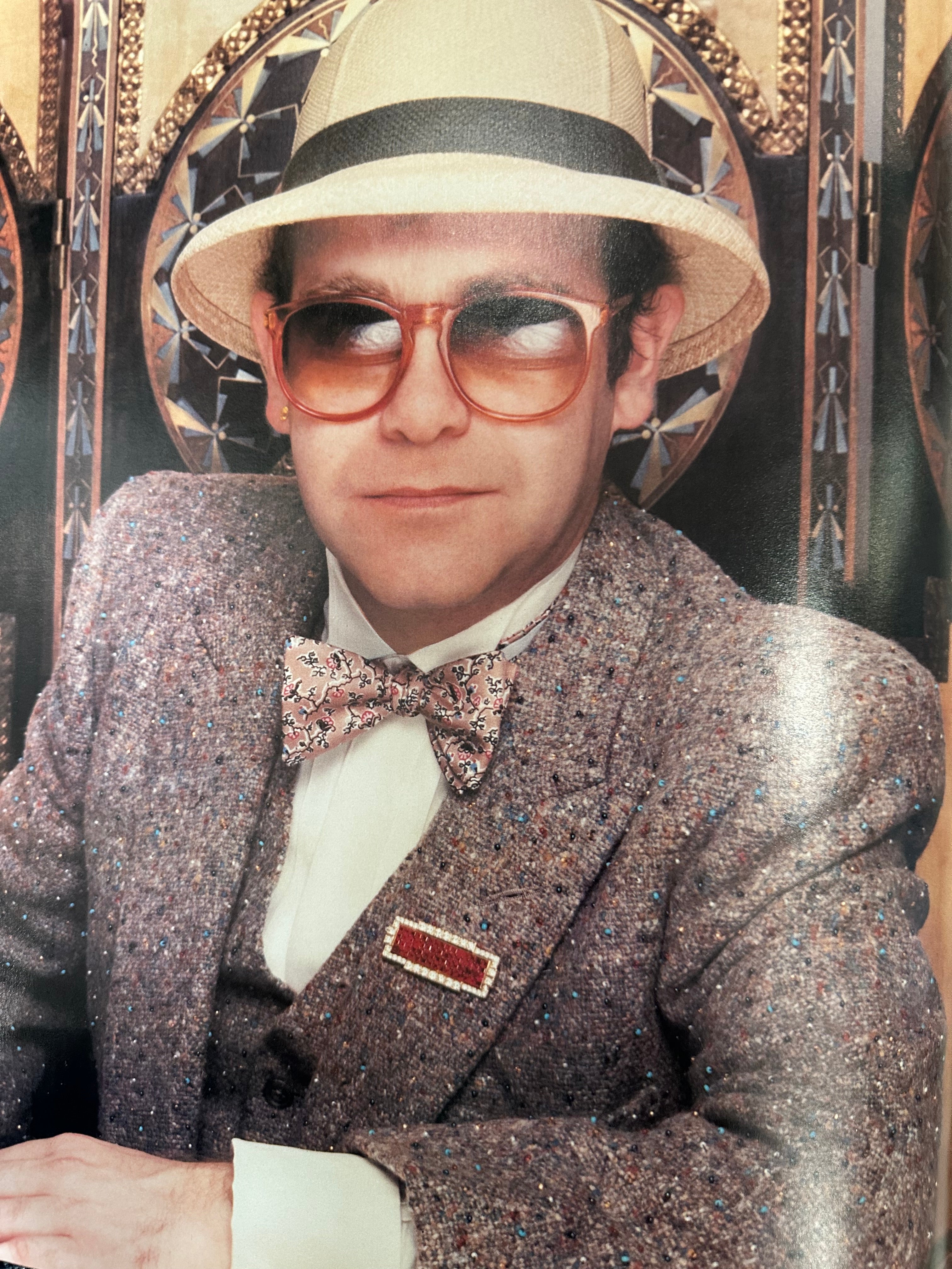 Elton John autographed program with pictures