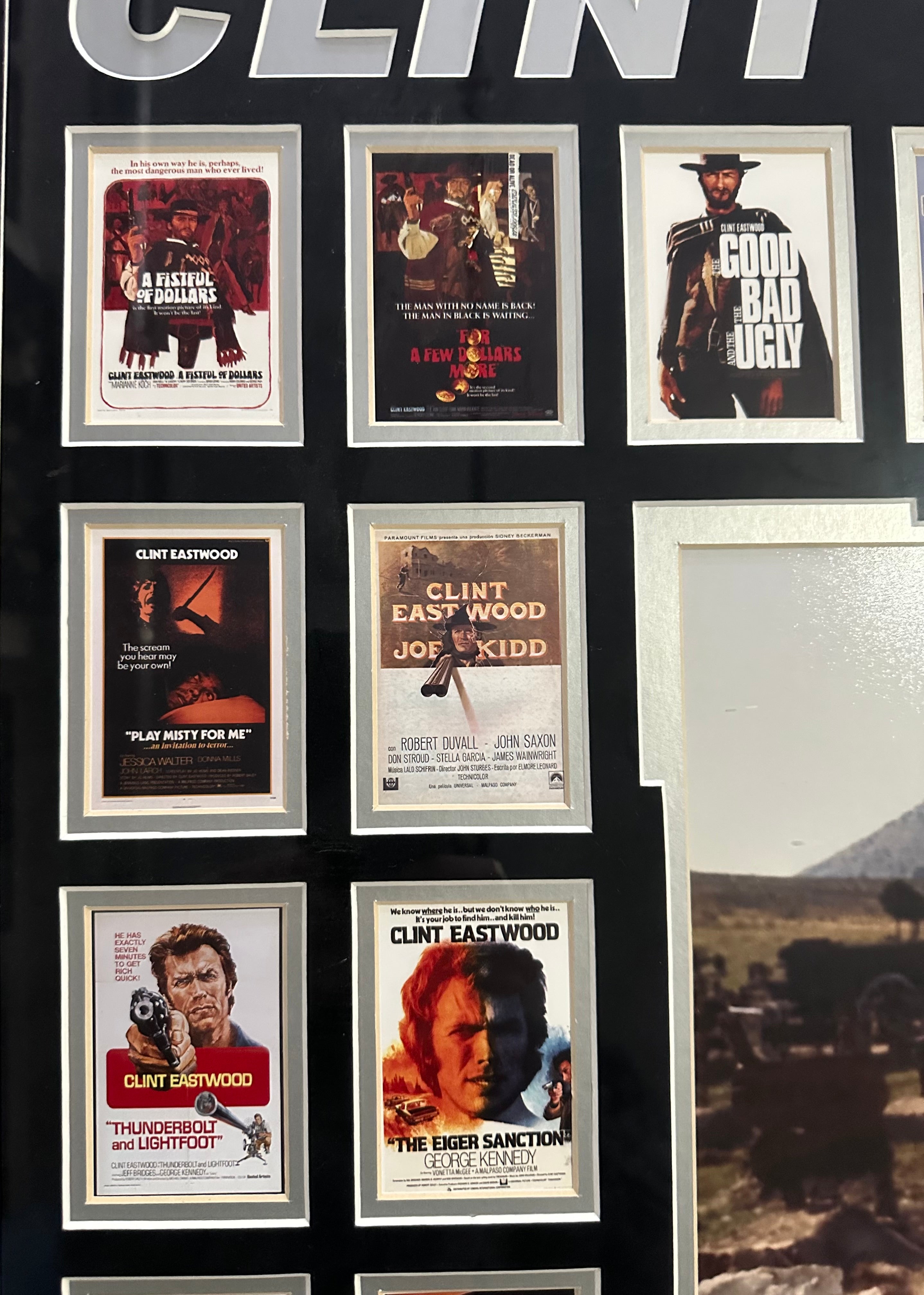 Clint Eastwood autographed 11x14 photo with 39 Eastwood movie posters