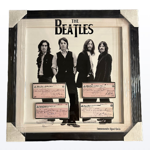 The Beatles with (Facsimile signed checks)