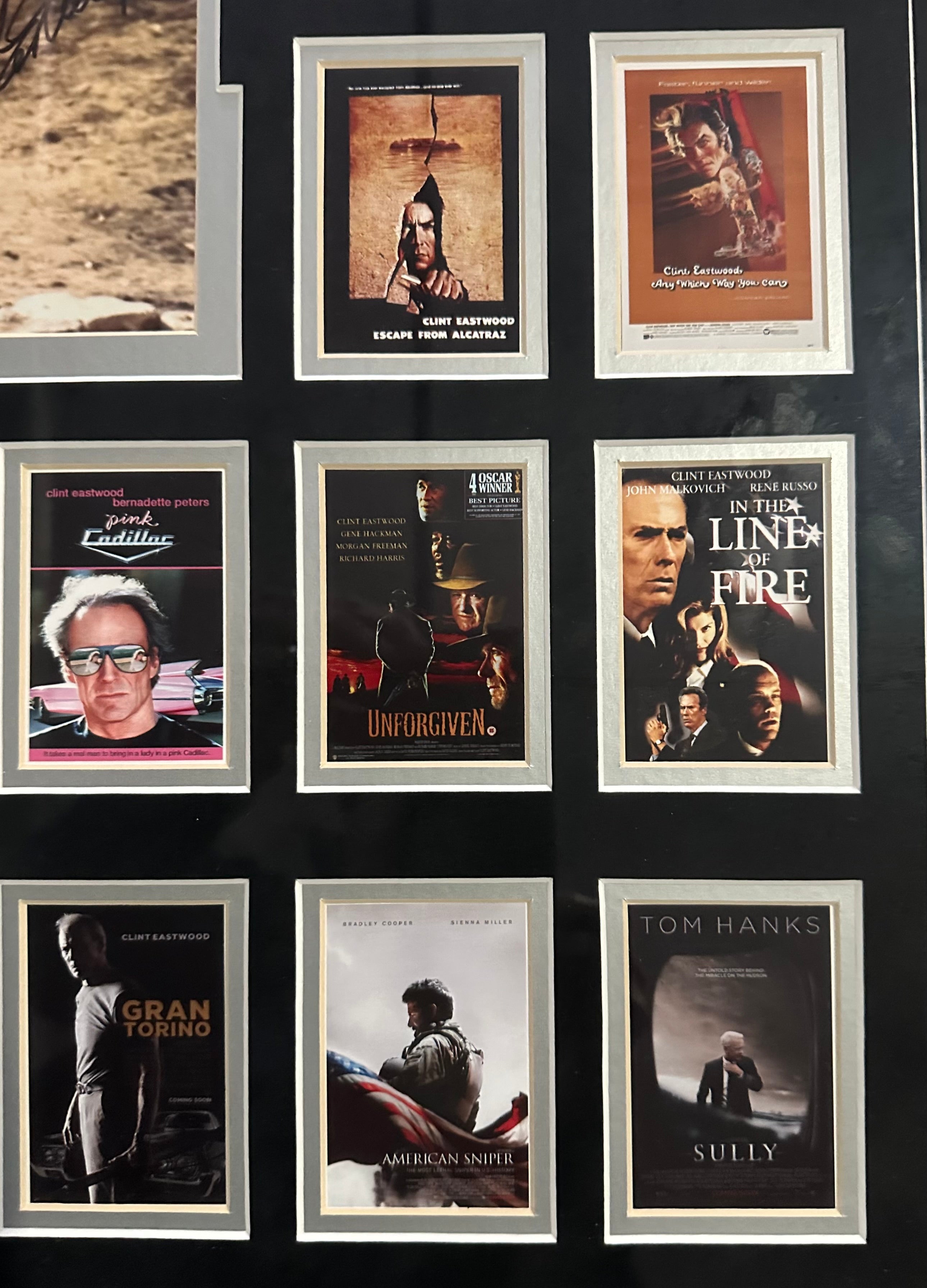 Clint Eastwood autographed 11x14 photo with 39 Eastwood movie posters