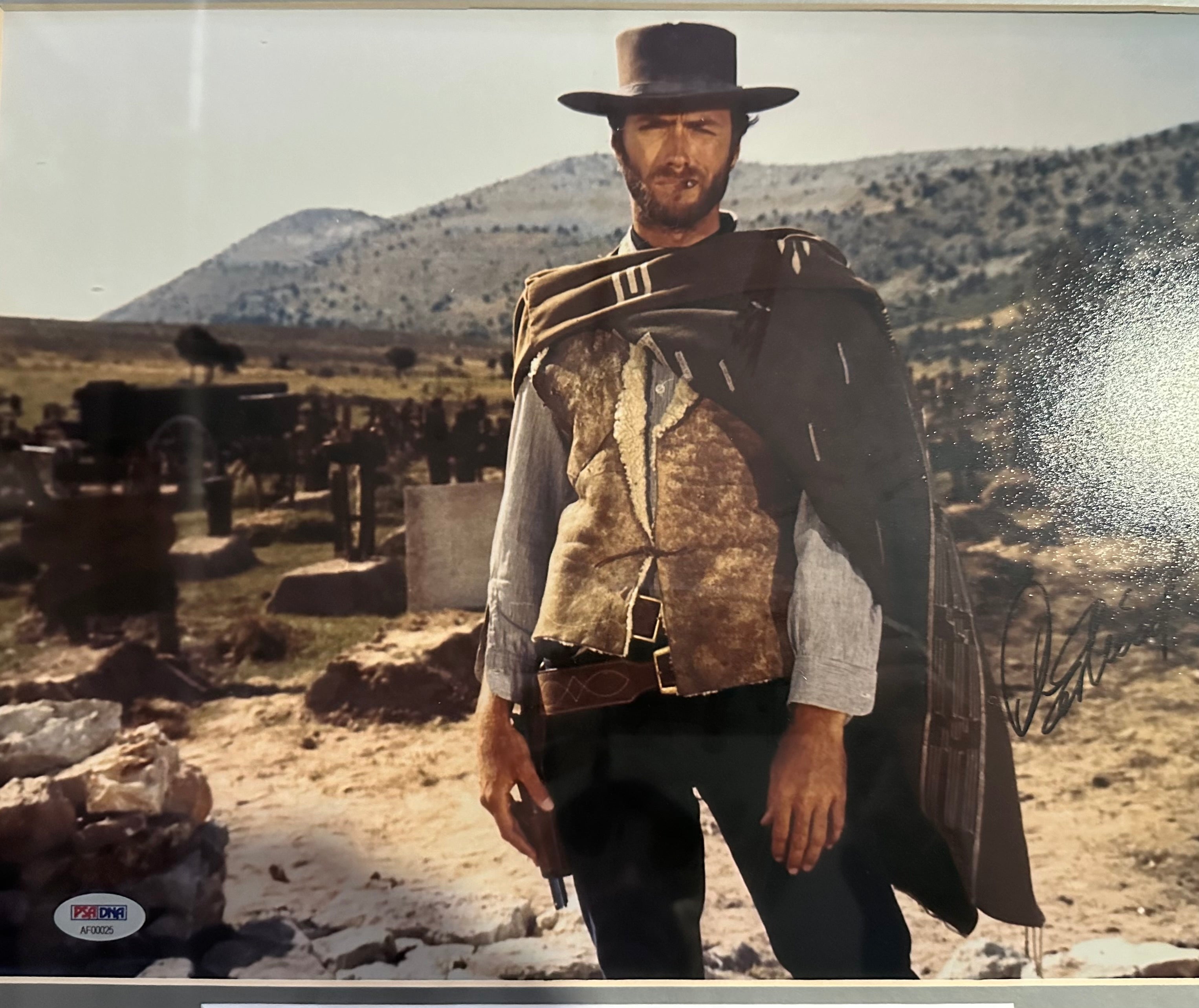 Clint Eastwood autographed 11x14 photo with 39 Eastwood movie posters