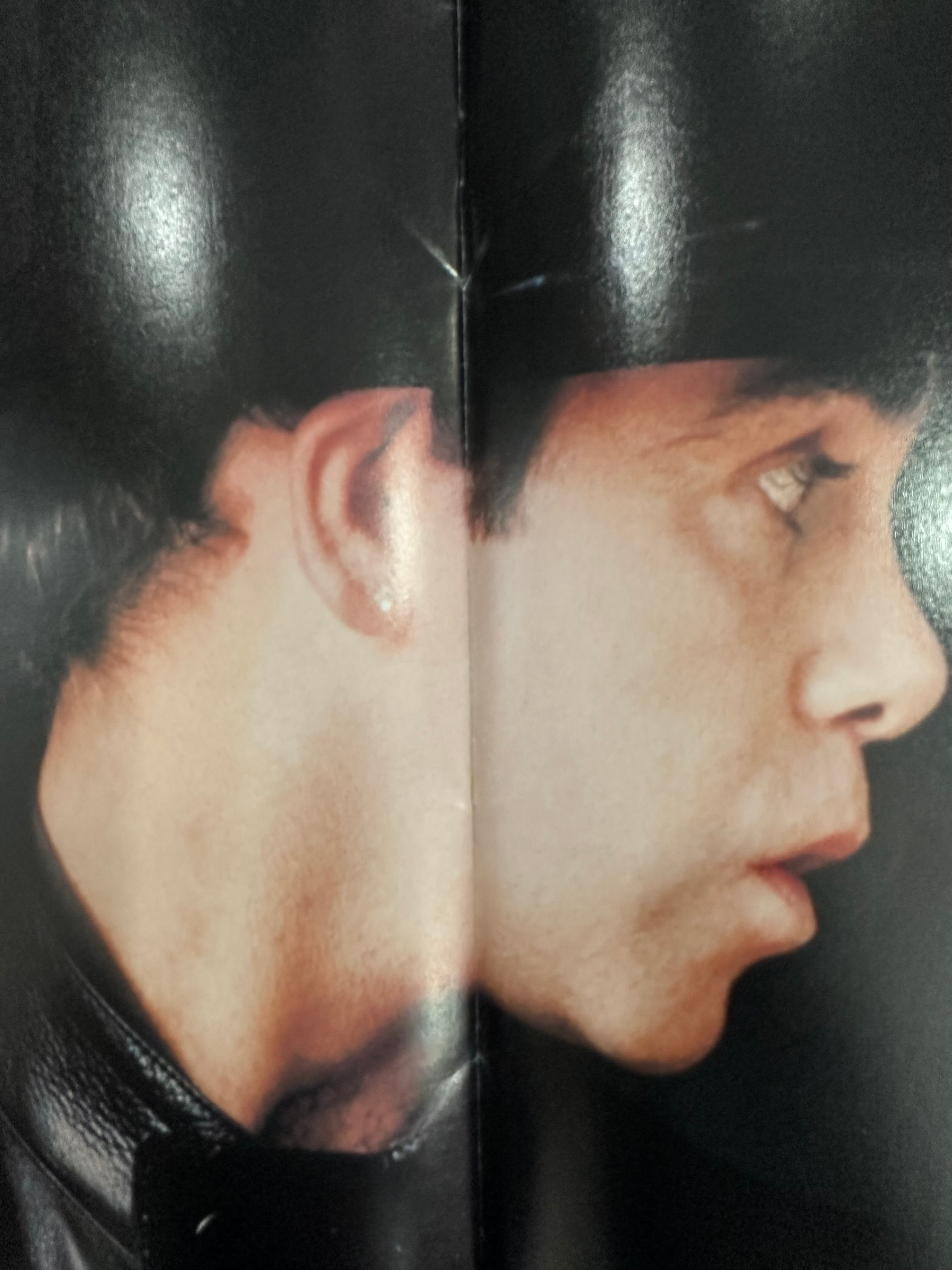 Elton John autographed program with pictures