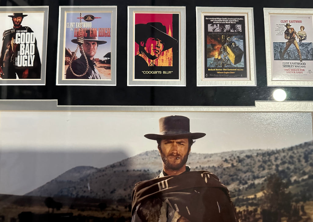 Clint Eastwood autographed 11x14 photo with 39 Eastwood movie posters