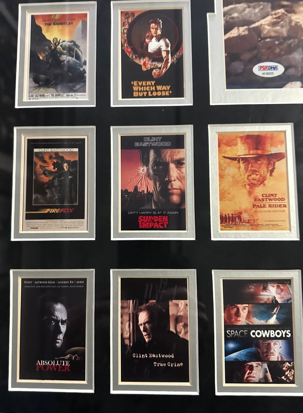 Clint Eastwood autographed 11x14 photo with 39 Eastwood movie posters